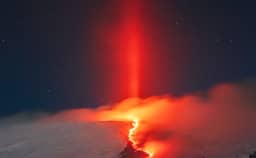 2025-02-24: Light Pillar over Erupting Etna